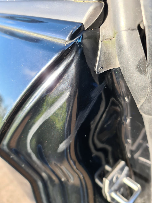 BMW 1 Series with damaged door shut. 