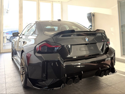 Black BMW M2 G87 model fitted with the Reverse Light and Reflector Tints in Dark. 