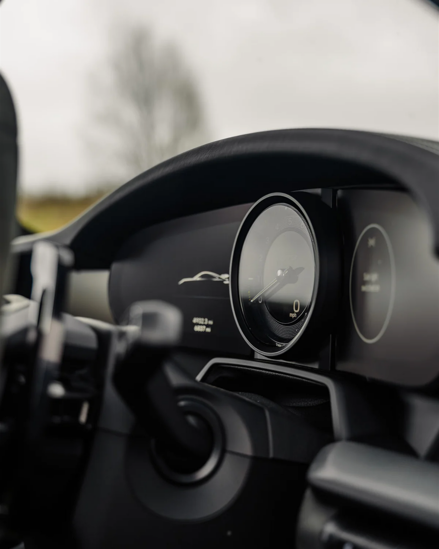 Close up of Porsche 911 992 digital dashboard display instrument panel screen protector.