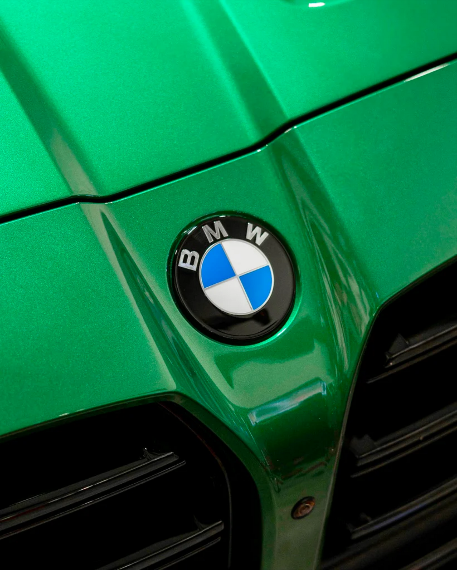 BMW M3 G80 G81 front badge roundel dechrome, demonstating one of many OEM automotive styling accessories offered.