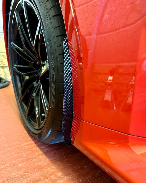 BMW M2 G87 front arch guards finished in carbon fiber, protecting the paintwork from stone chips, and road debris.