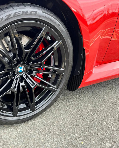BMW M2 G87 front mud flaps in gloss black, protecting the paintwork and rear arches from stone chips, and road debris.