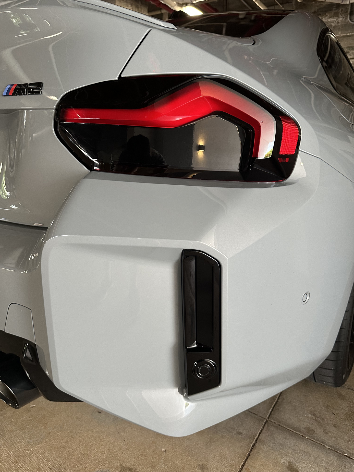 BMW G87 model fitted with the Reflector and Reverse Light Tints in the Dark shade.