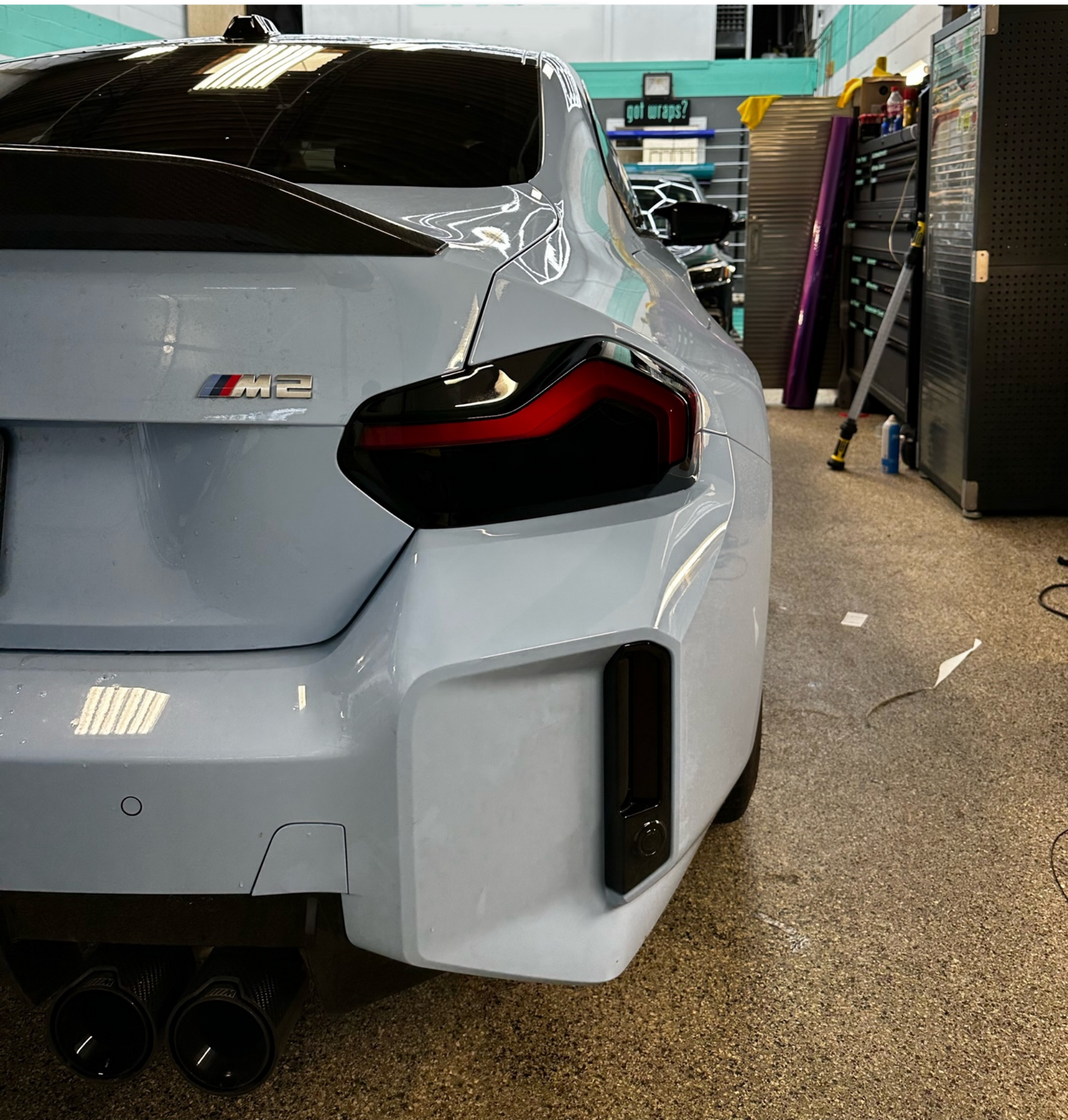 Alternate close up of the Blue BMW G87  M2 model fitted with the Reflector and Reverse Light Tints in Dark.