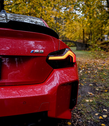 BMW G87 M2 in Red fitted with the Reflector and Reverse light Tint in Dark.