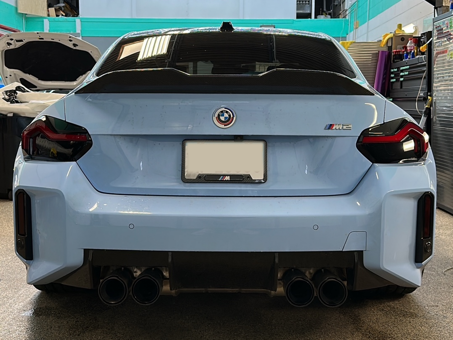 Blue BMW M2 G87 fitted with the Reflector and Reverse Light Tints in Dark shade.