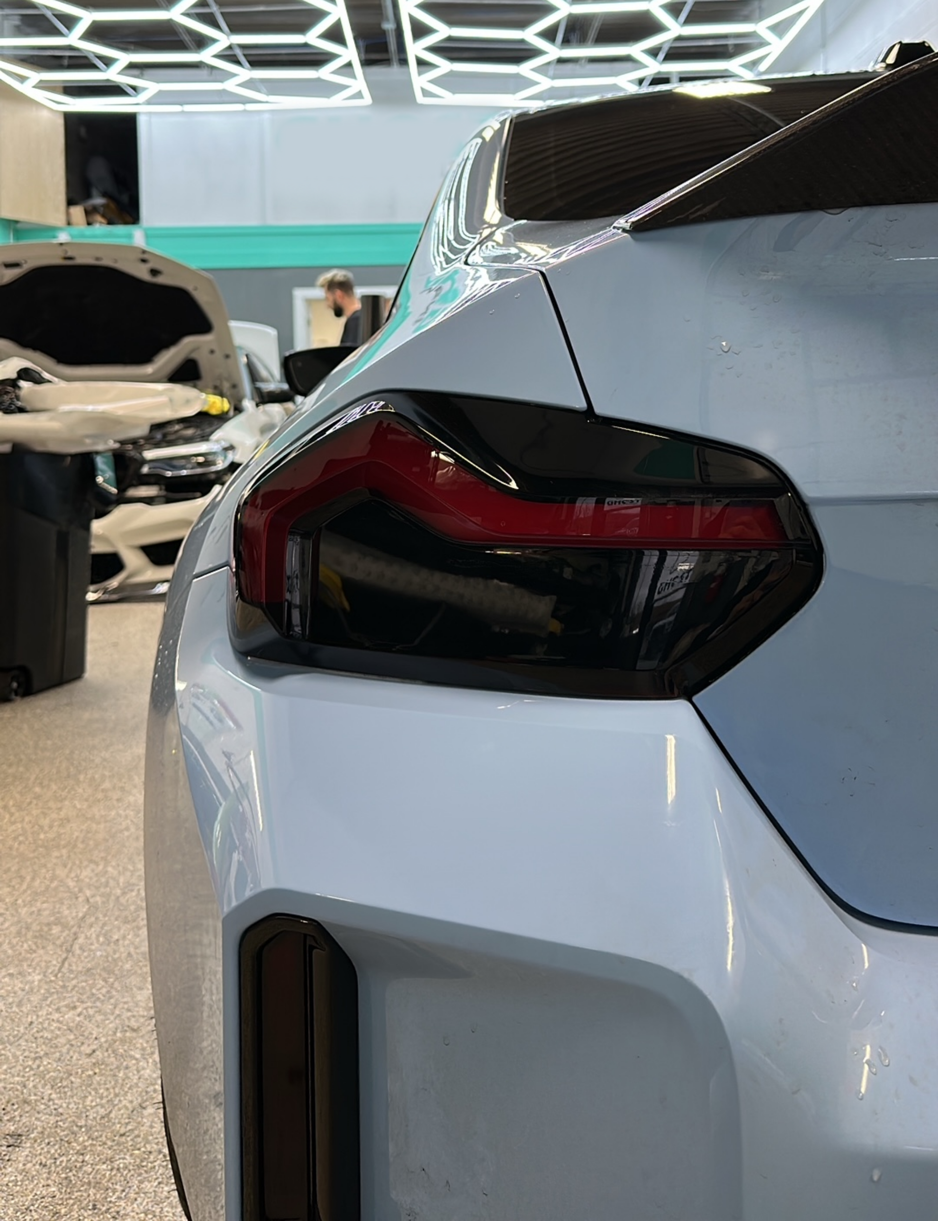 Close up of the Blue BMW M2 G87 model fitted with the Reflector and Reverse Light Tints in Dark.