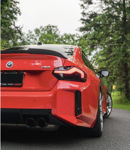 Red BMW M2 G87 model fitted with the Reverse Light and Reflector Tint in Dark. 