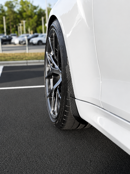 BMW M2 & M2 Competition F87 Carbon Fibre arch guards mudflaps installed on the front of the car.