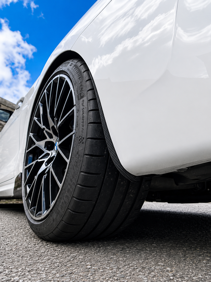 BMW M2 & M2 Competition F87 Carbon Fibre arch guards mudflaps installed on the rear of the car.