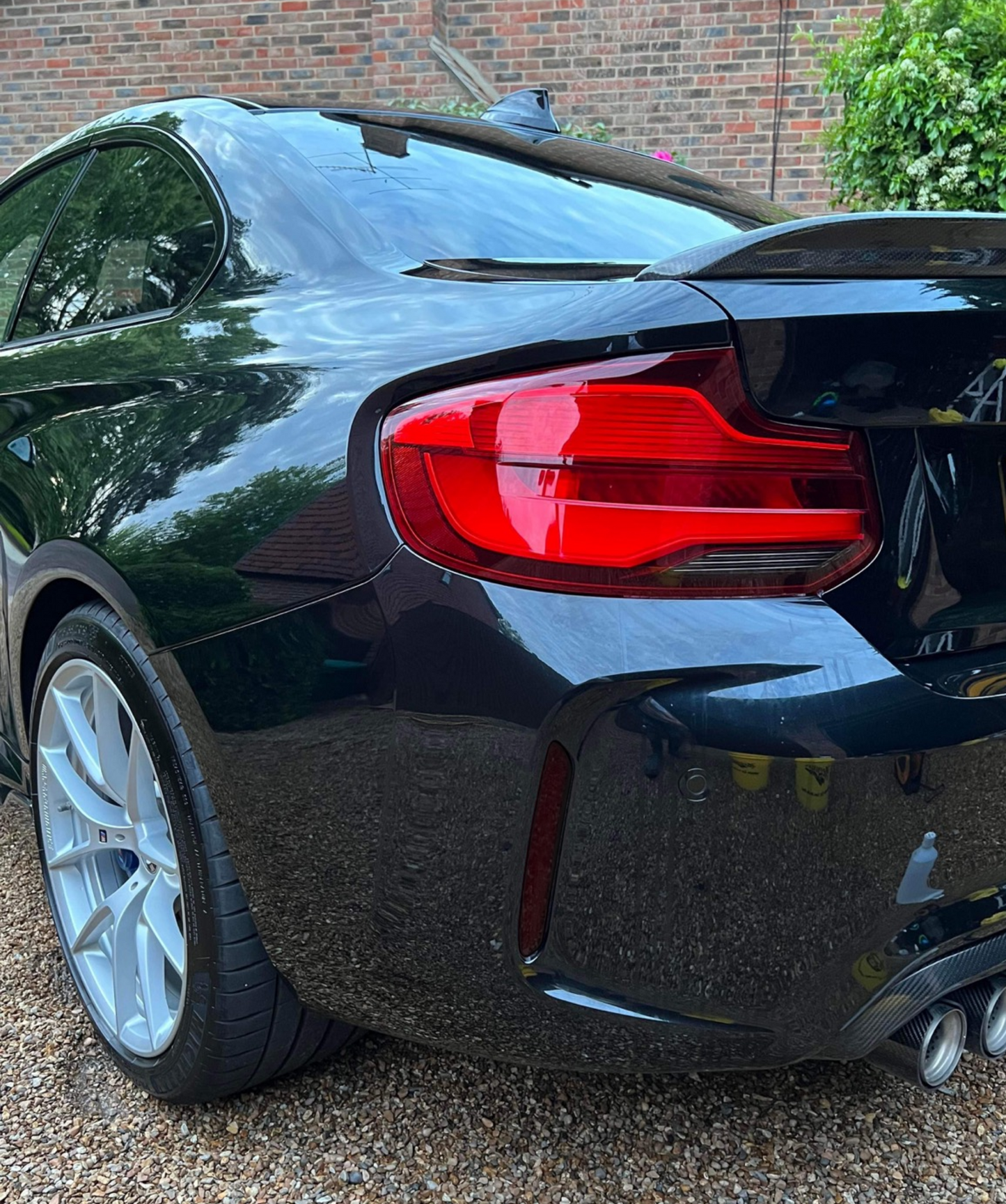 Black BMW M2 M2C F87 fitted with Reflector Tint Kit in Dark. 