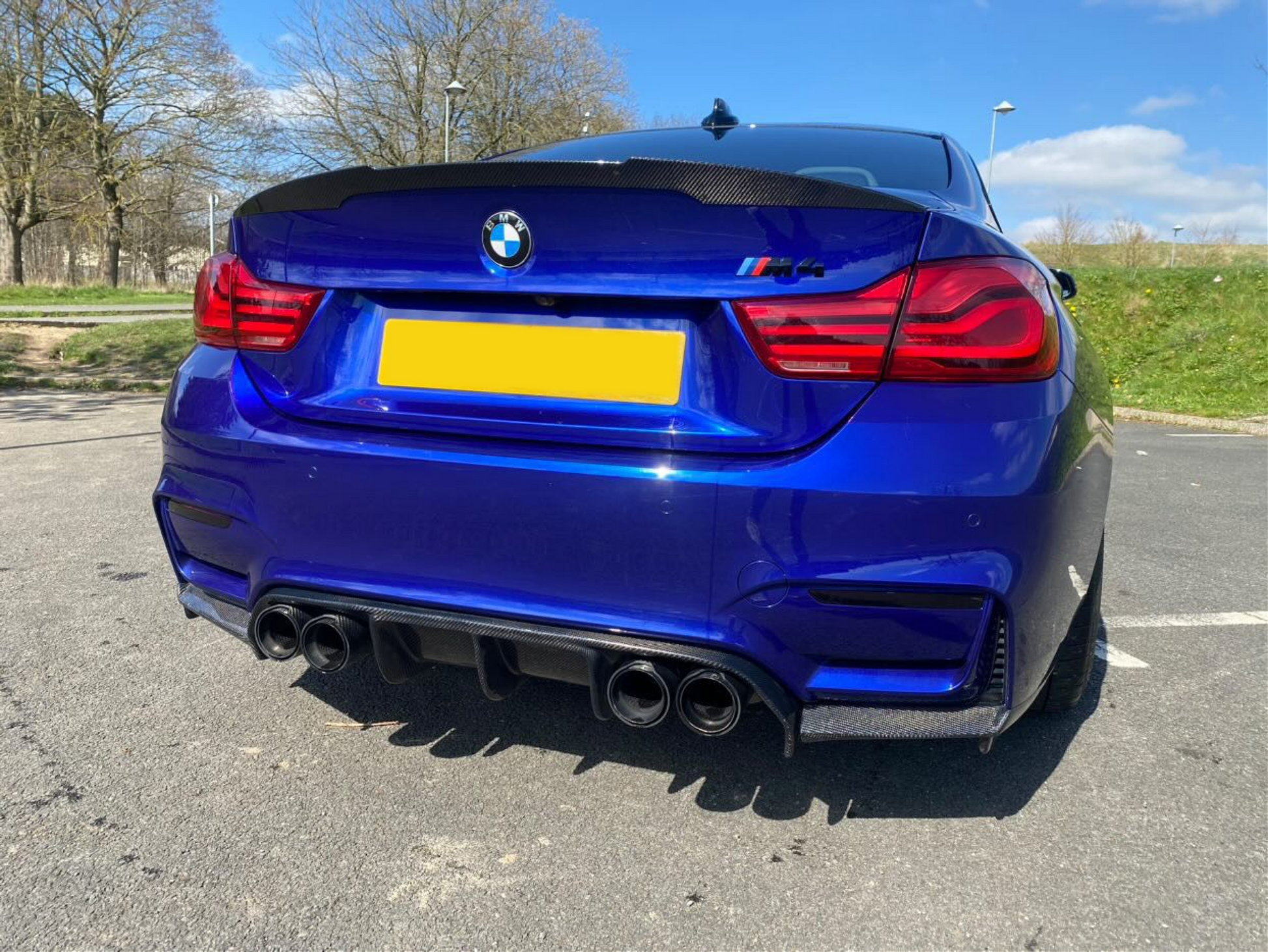 BMW M3 F80 & M4 F82 rear reflector light tint overlays featuring larger exhaust tips.