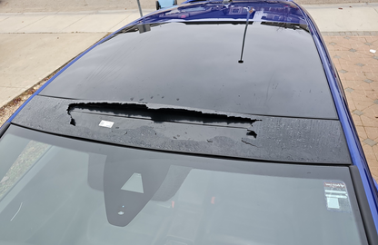 VW Golf MK8 and MK8.5 smashed panoramic roof from stone / rock on freeway.